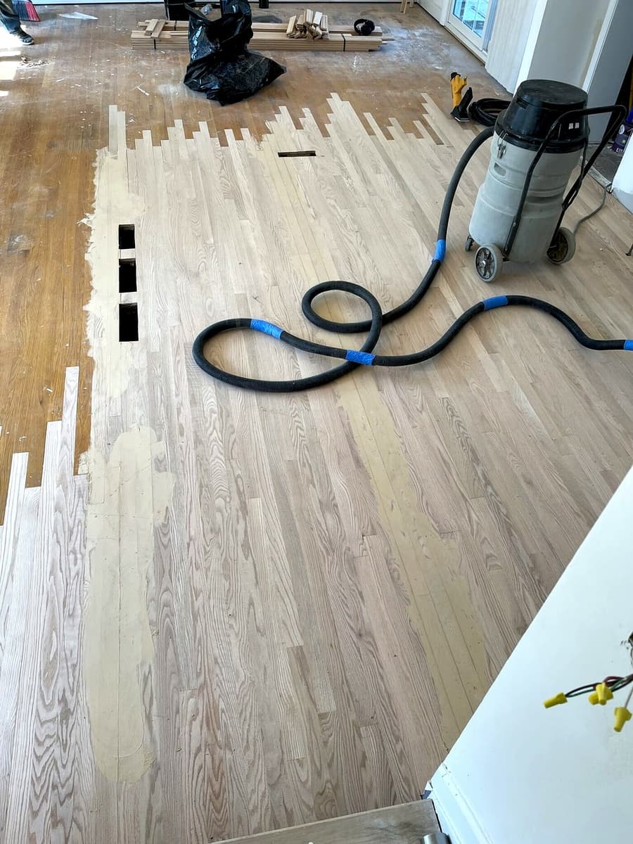 Red oak floor refinishing in progress